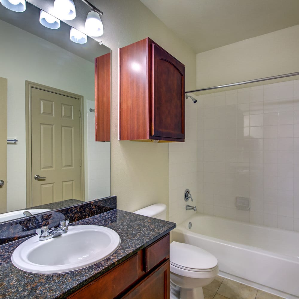 Bathroom with built in cabinetry at Estates at Canyon Ridge in San Antonio, Texas