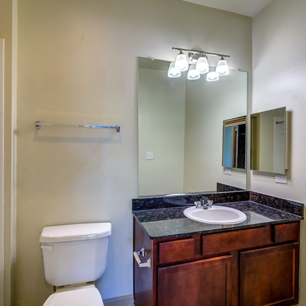 Bathroom with sink cabinet at Estates at Canyon Ridge in San Antonio, Texas