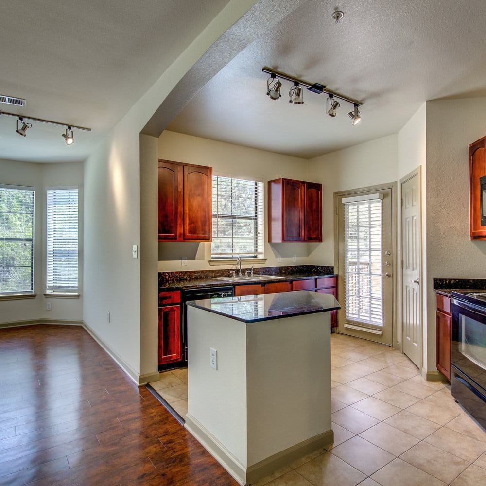 Modern kitchen with a kitchen island at Estates at Canyon Ridge in San Antonio, Texas
