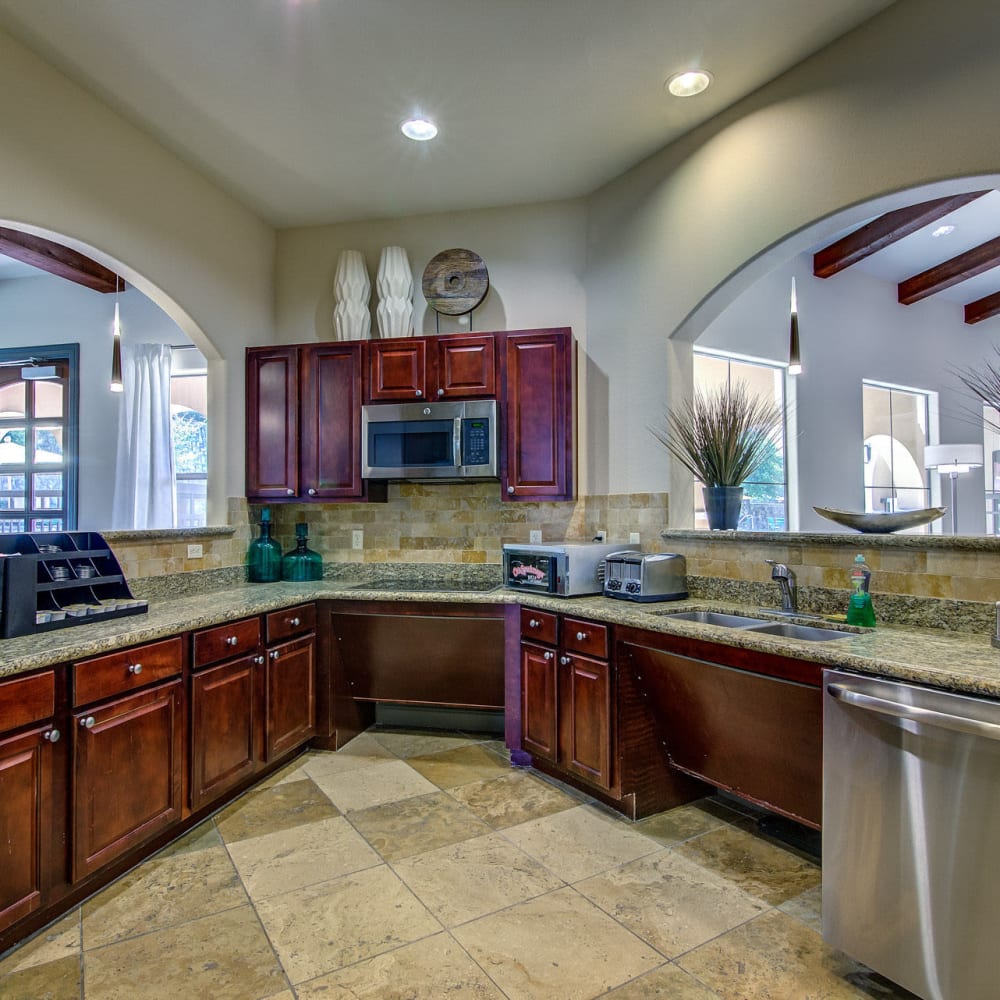 Clubhouse chef kitchen with beautiful cabinetry at Estates at Canyon Ridge in San Antonio, Texas