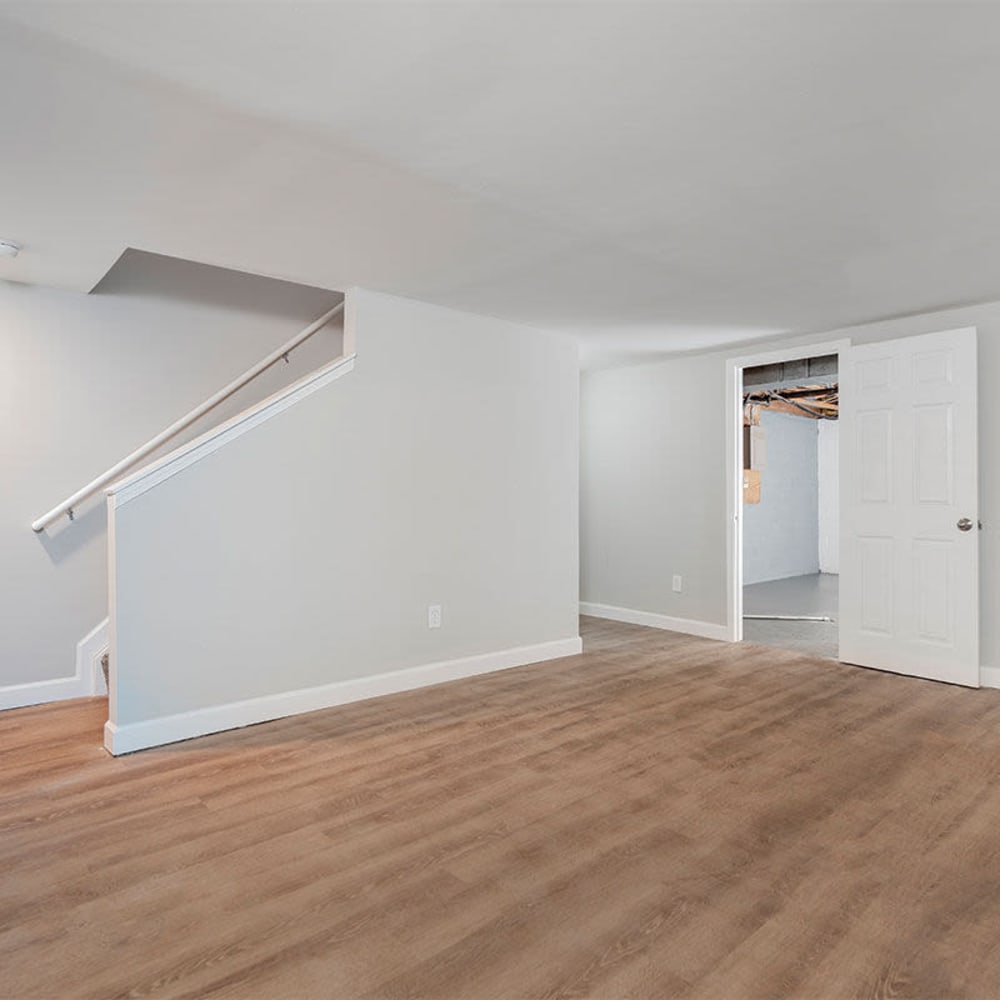 Basement space with wood-style flooring at Mason Row Townhomes in Dublin, Ohio
