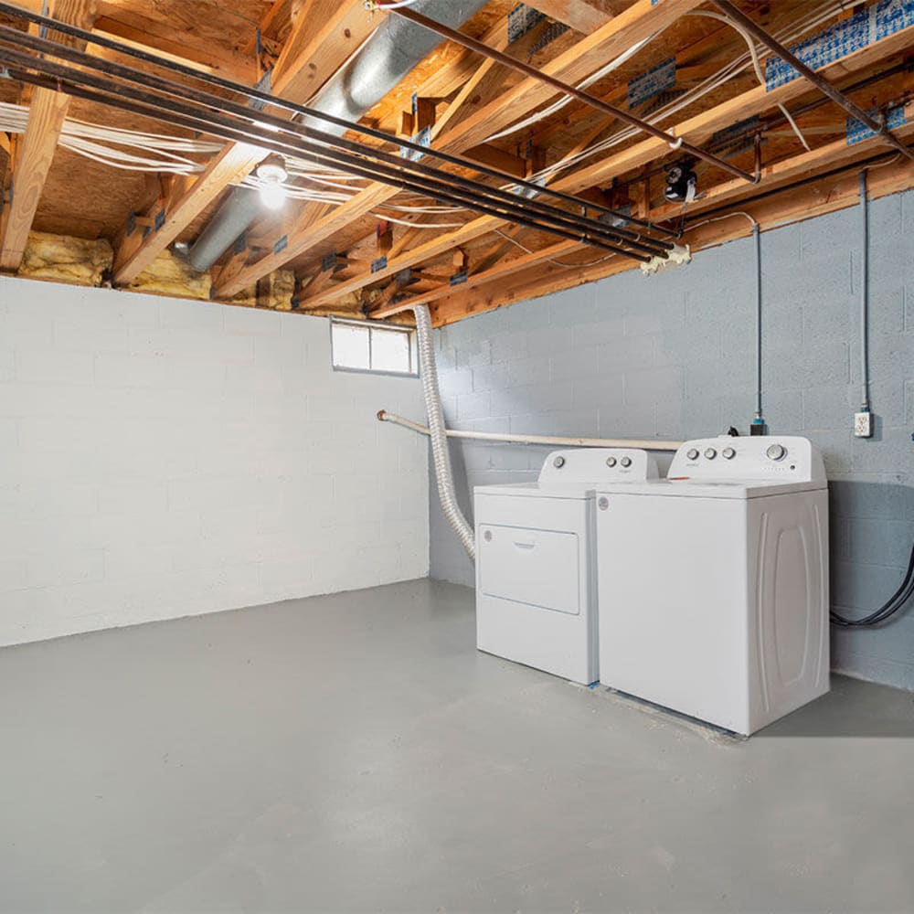 Basement with washer and dryer at Mason Row Townhomes in Dublin, Ohio