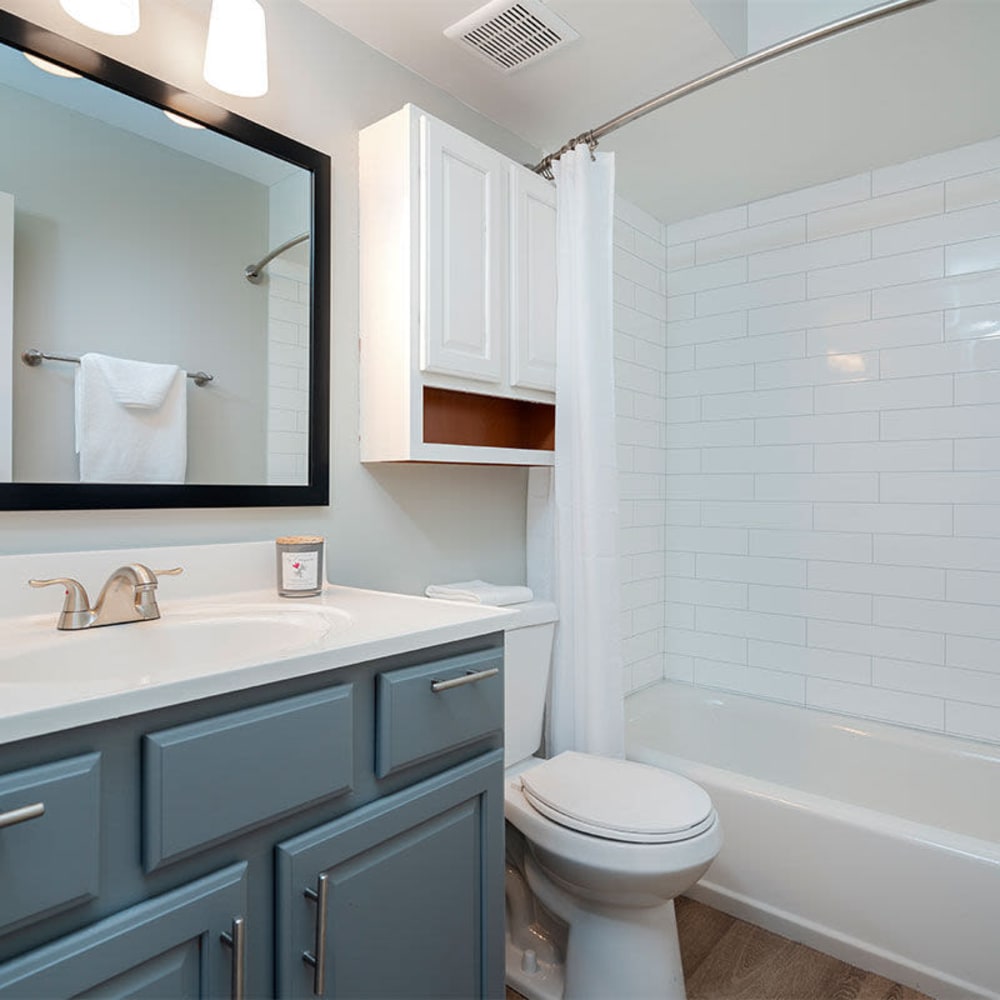 Resident bathroom with extra cabinetry at Mason Row Townhomes in Dublin, Ohio