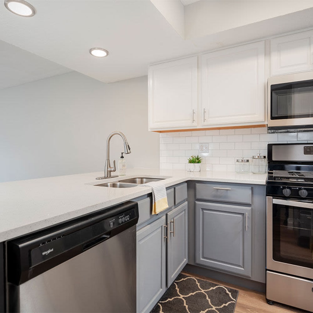 Modern kitchen with a dishwasher at Mason Row Townhomes in Dublin, Ohio