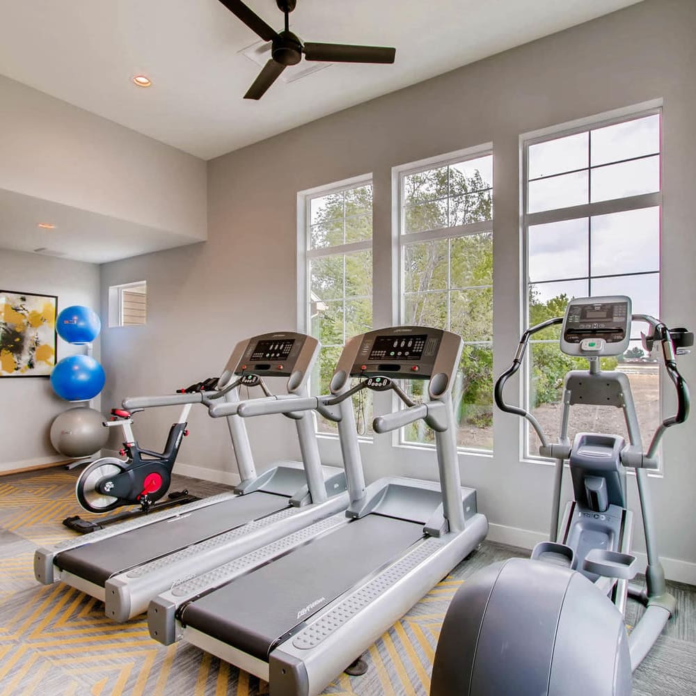 Fitness center with treadmills at Village On Cypress in Thornton, Colorado