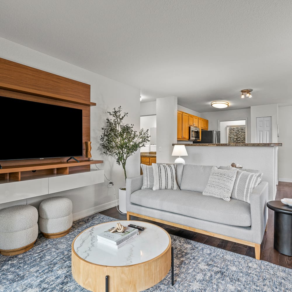 Spacious and modern open-concept floor plan with hardwood style flooring in a model home at Timbers at Tualatin in Tualatin, Oregon