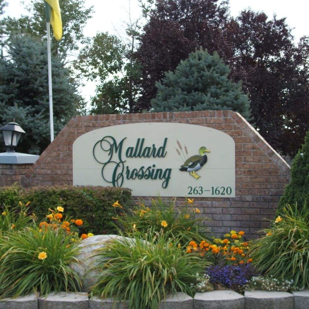 The main sign in front of Mallard Crossing Apartments in Millcreek, Utah