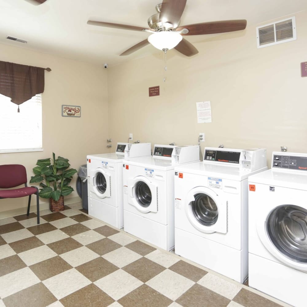 A row of washing machines in the laundry room at Chadds Ford Apartments in Midvale, Utah
