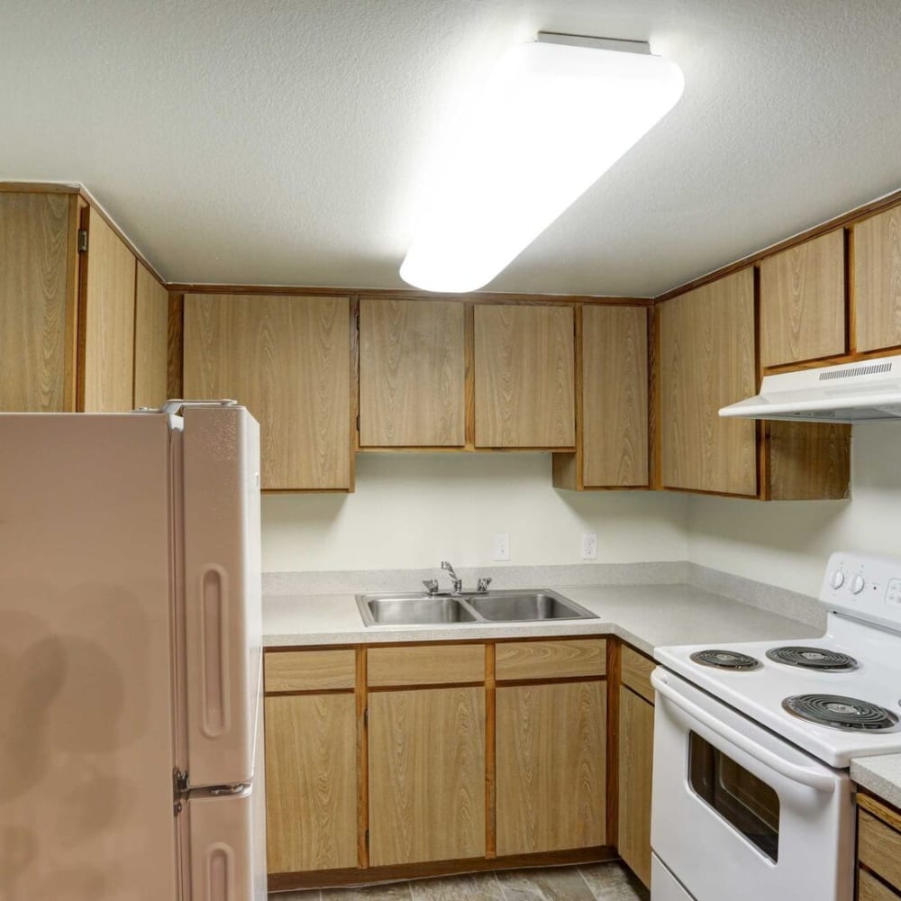 White appliances in an apartment kitchen at Regency Apartments in Salt Lake City, Utah
