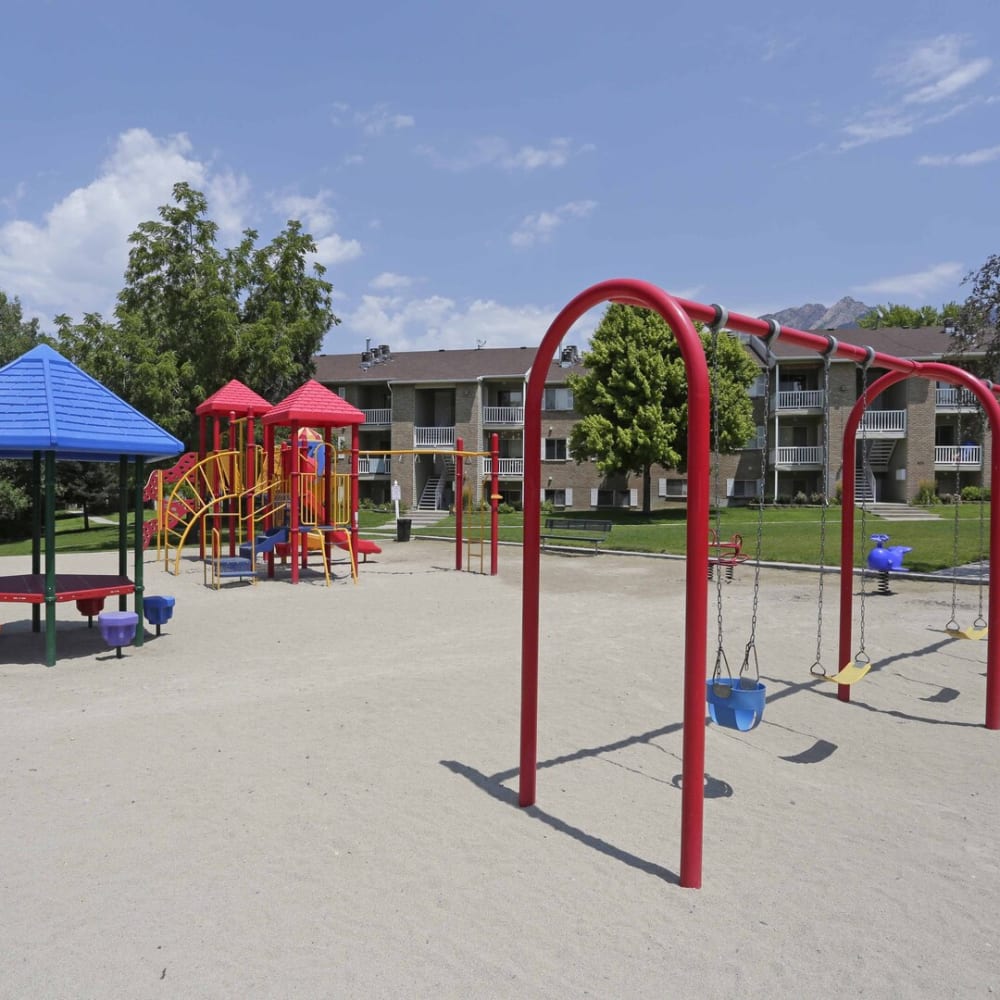 The community swing set and playground at Highland Pointe Apartments in Cottonwood Heights, Utah