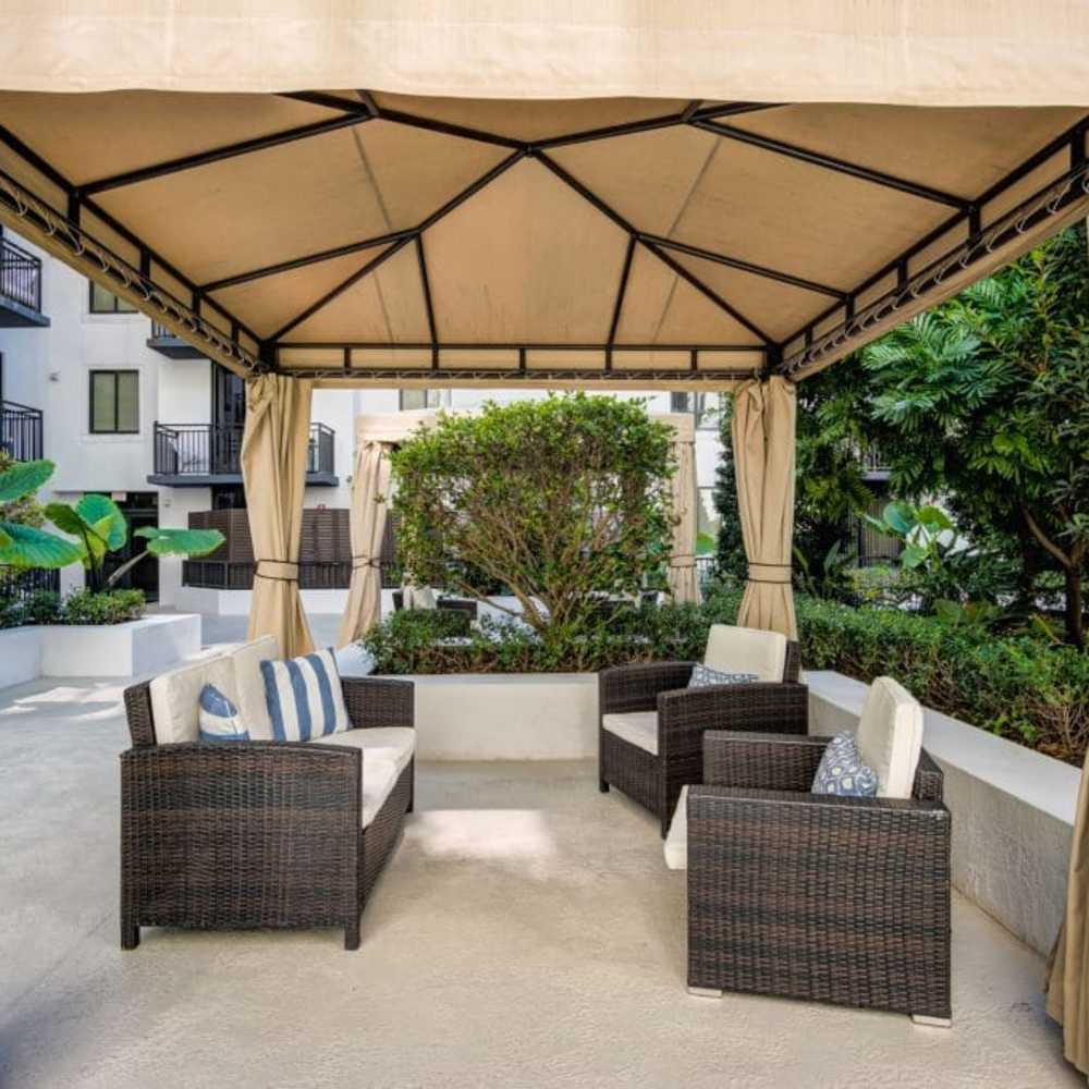 Outdoor covered seating at Club Prado in West Miami, Florida