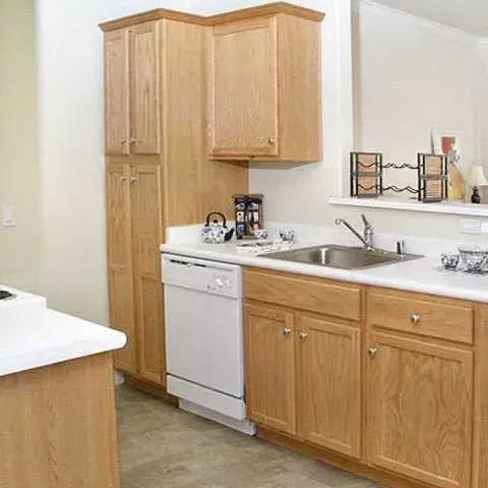 Kitchen with white appliances at Torcello Apartments in Stockton, California