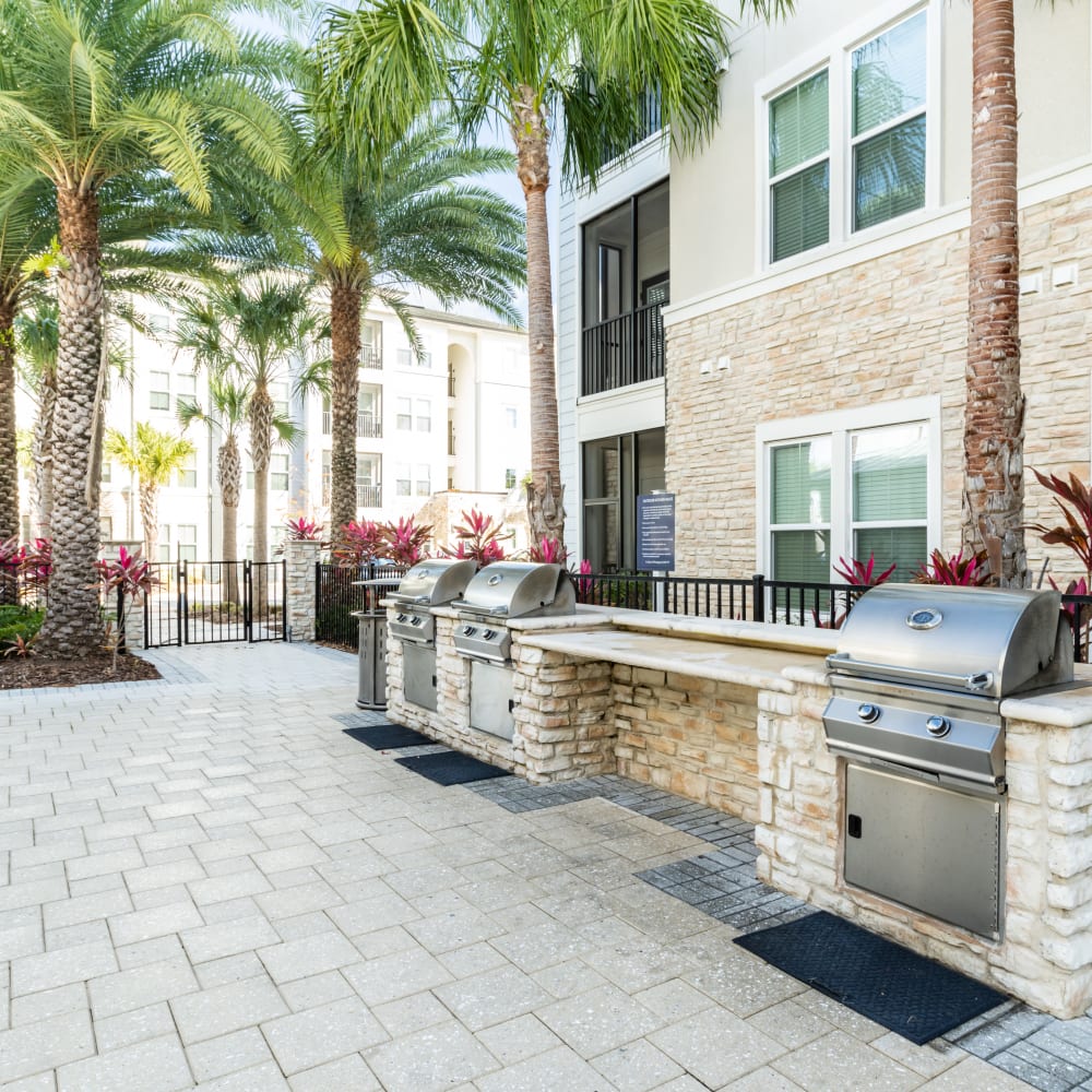 Barbequing stations at Audubon Park Apartments in Orlando, Florida