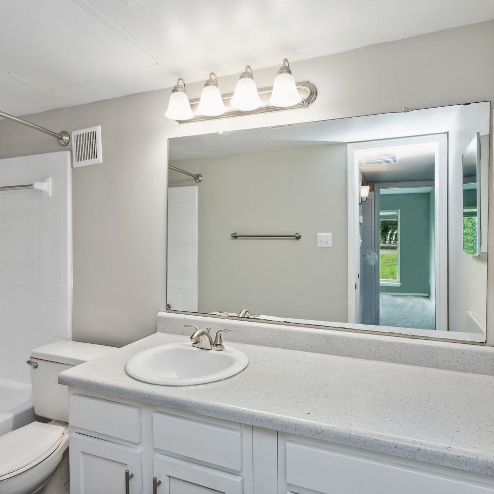 An apartment bathroom with a full-sized bathtub at Park West End in Richmond, Virginia