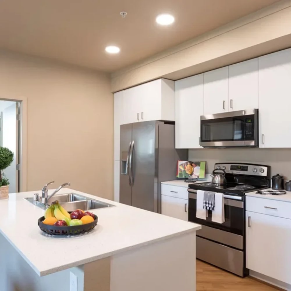 Kitchen with prep island at Stonebrier Apartments in Stockton, California