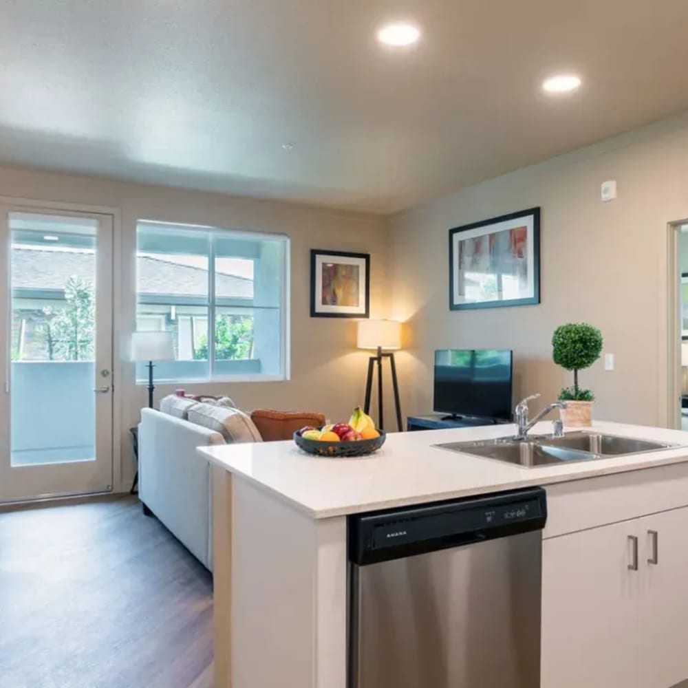 Kitchen and living room at Stonebrier Apartments in Stockton, California