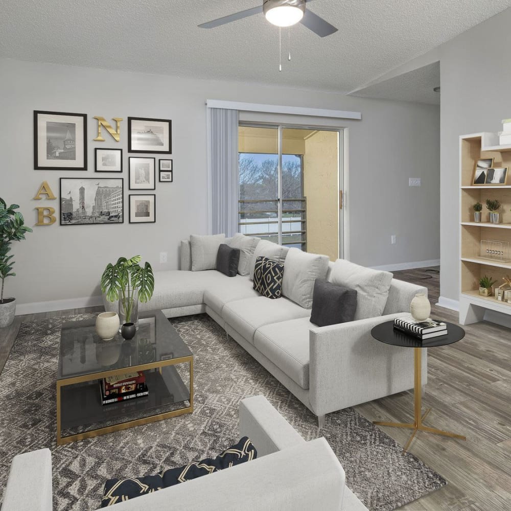Living space with wood-style flooring at Parke East in Orlando, Florida