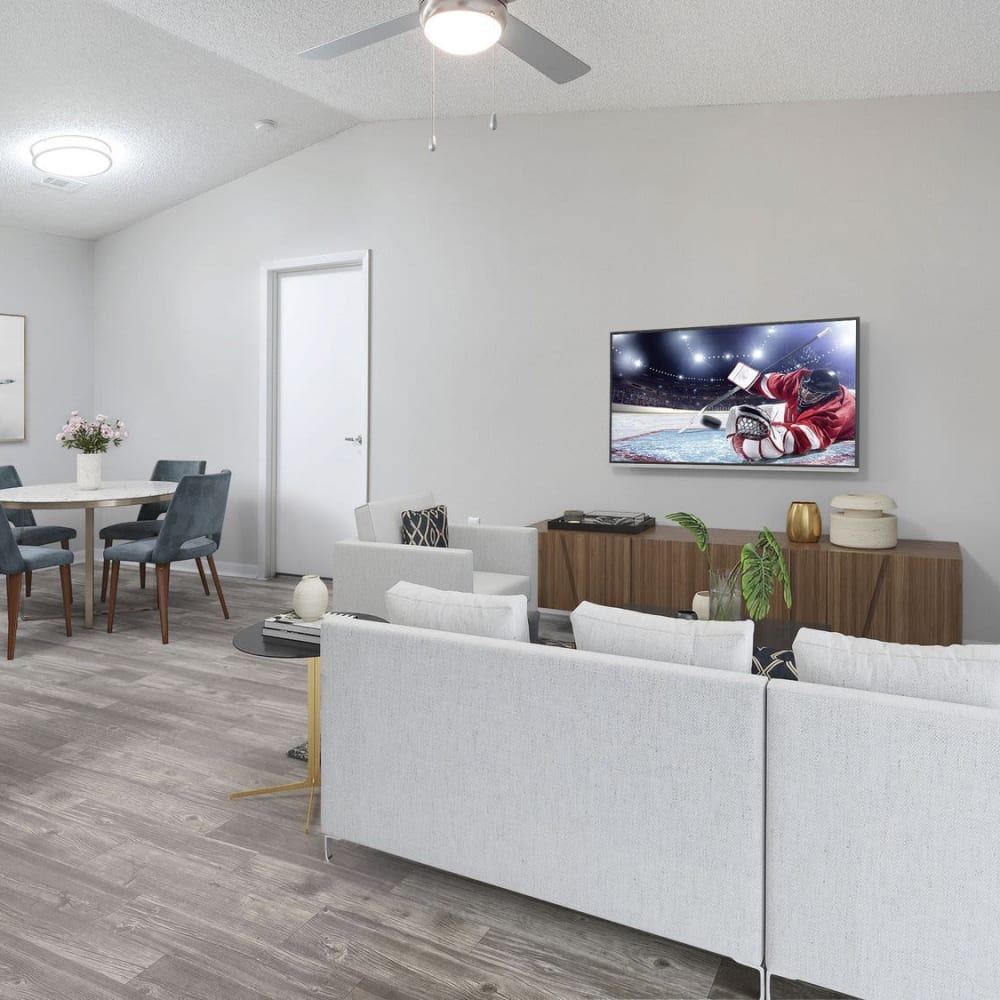 Living space with a ceiling fan at Parke East in Orlando, Florida