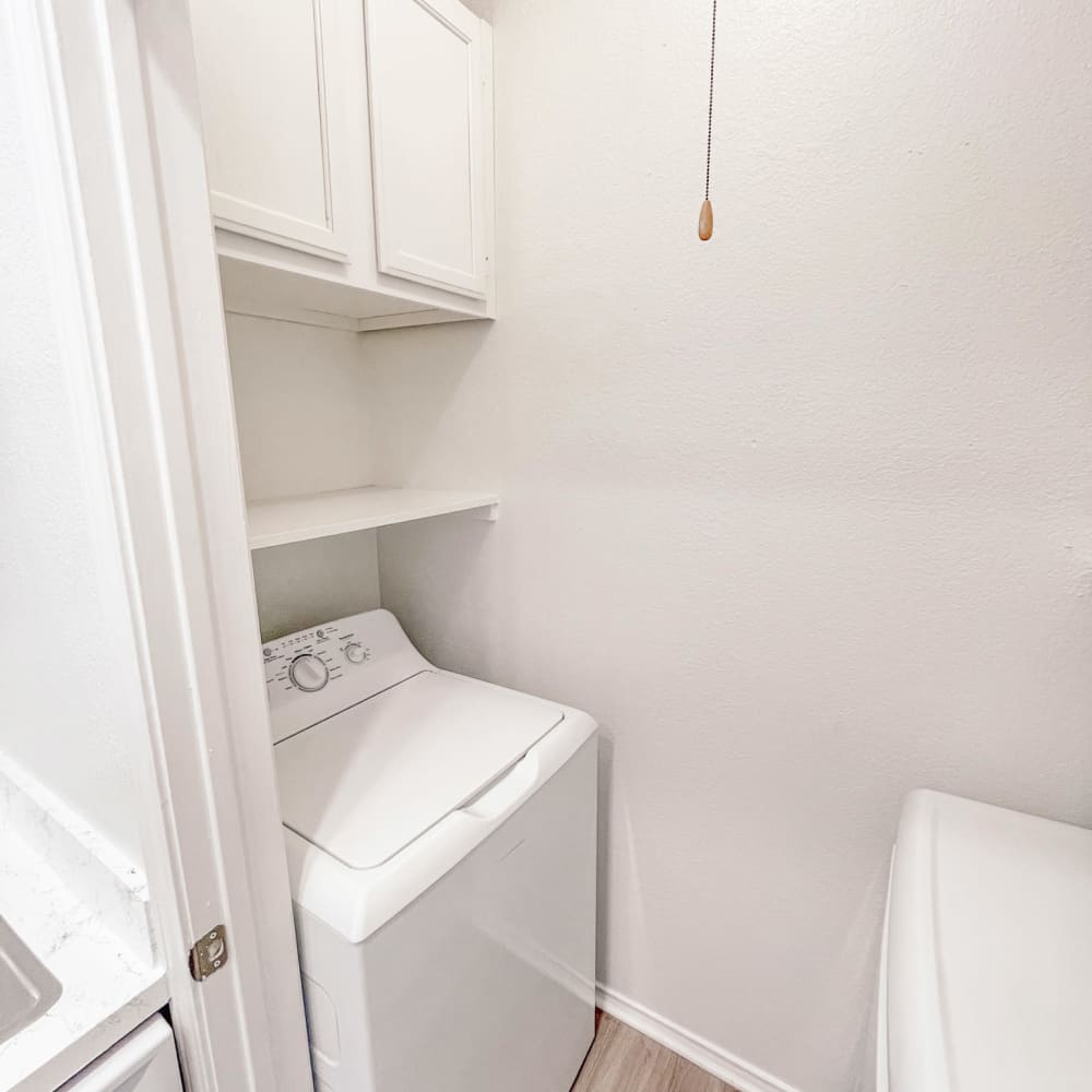 Compact laundry room at Oaks White Rock