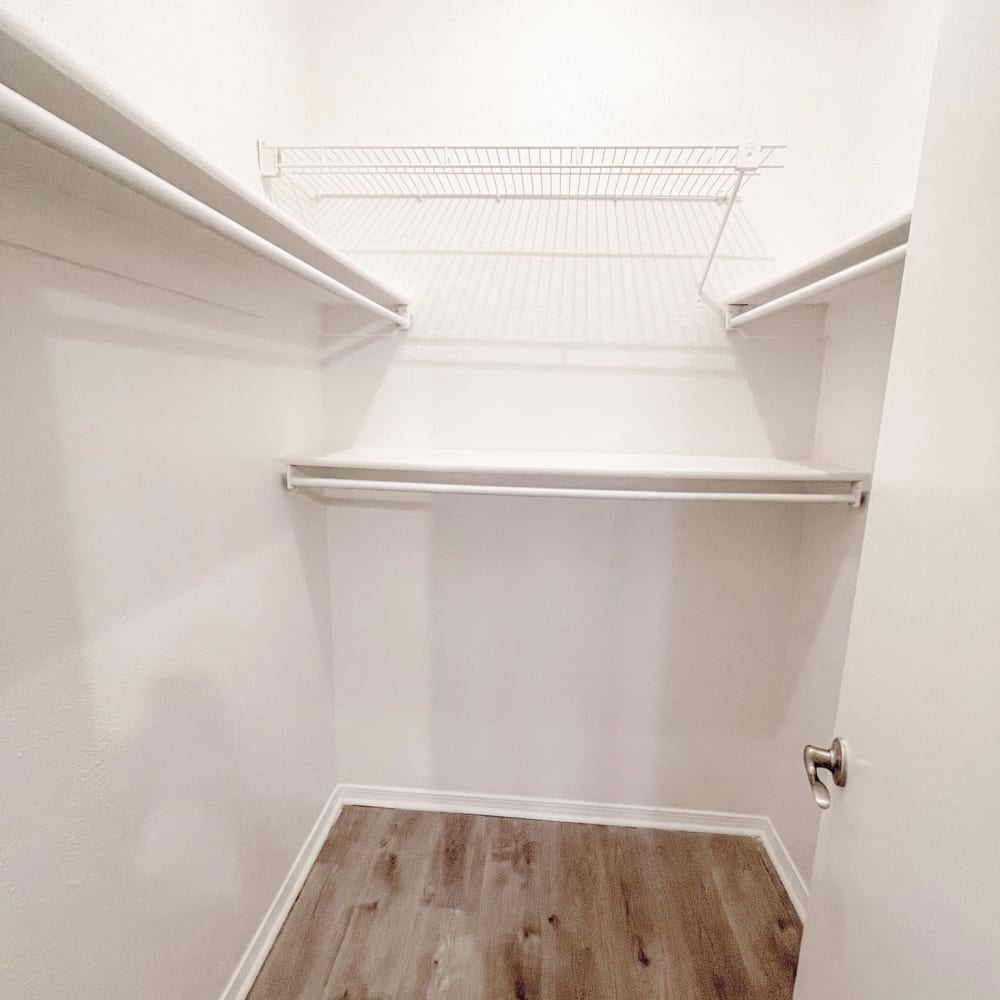 Spacious closet with plenty of wall shelving and storage at Oaks White Rock