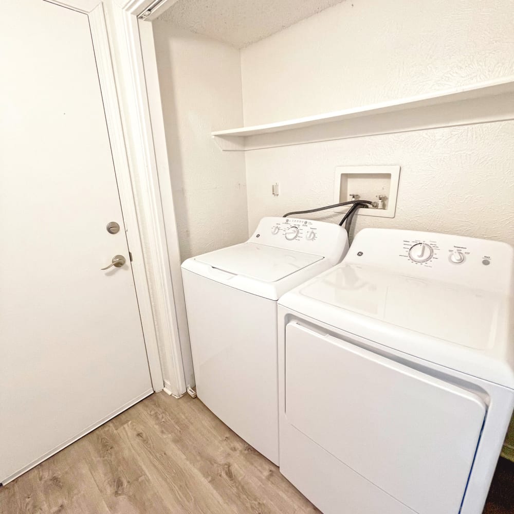 Washer and dryer room at Oaks White Rock 