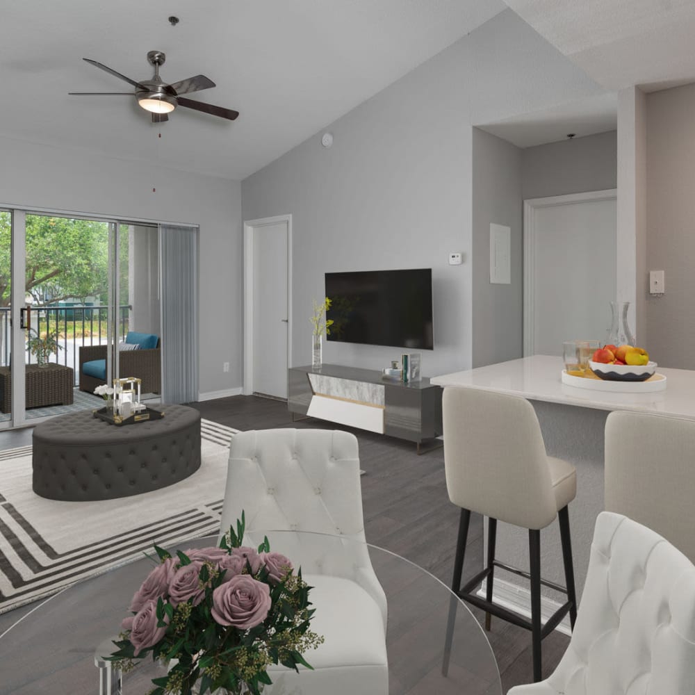 Large open living space with wood-style flooring at Aspire at Gateway in Pinellas Park, Florida