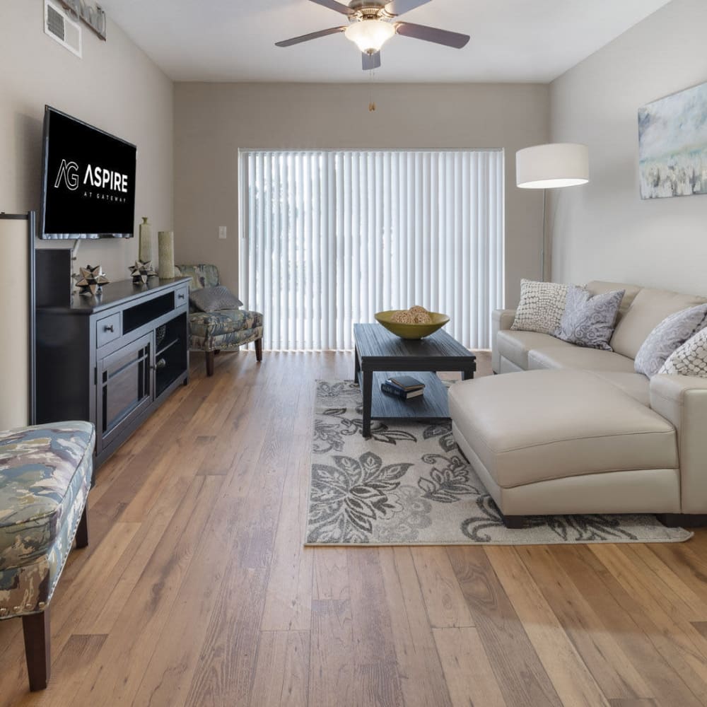 Living space with wood-style flooring at Aspire at Gateway in Pinellas Park, Florida