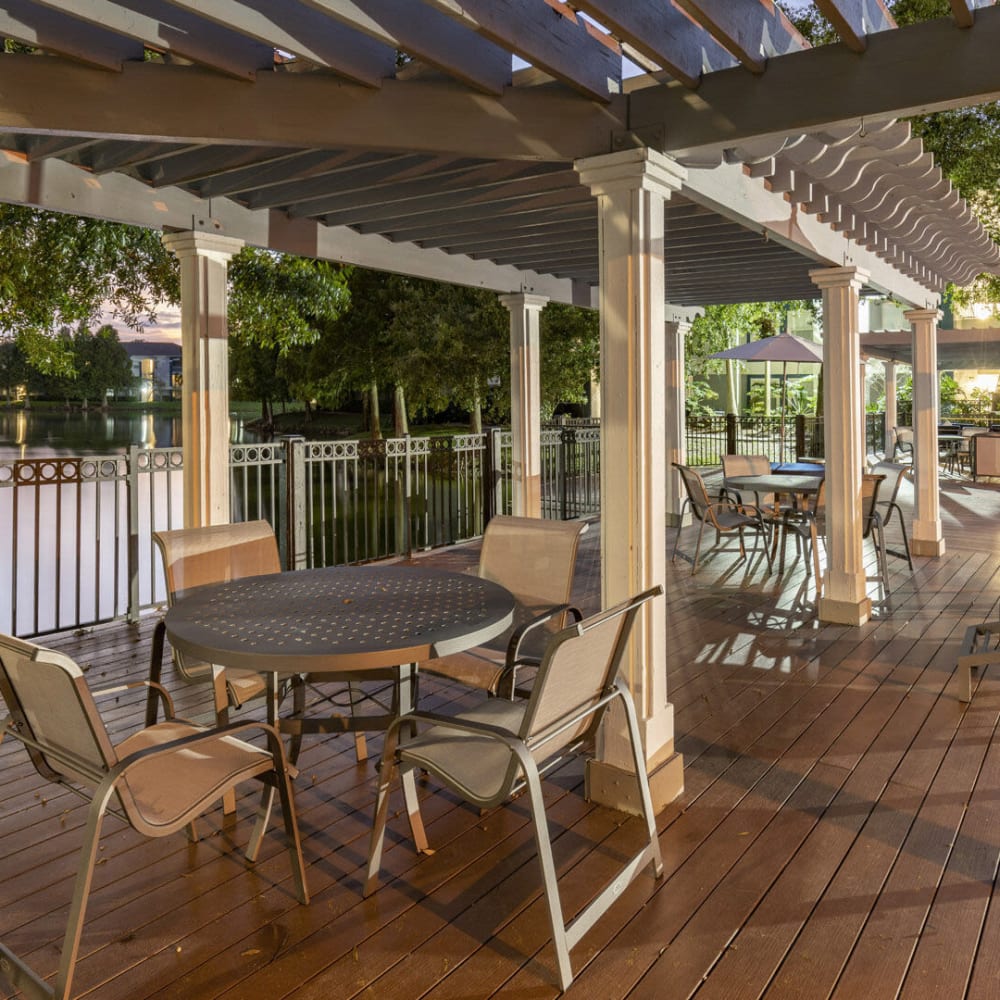 Patio tables and chairs on the sundeck at Sabal Palm in Tampa, Florida