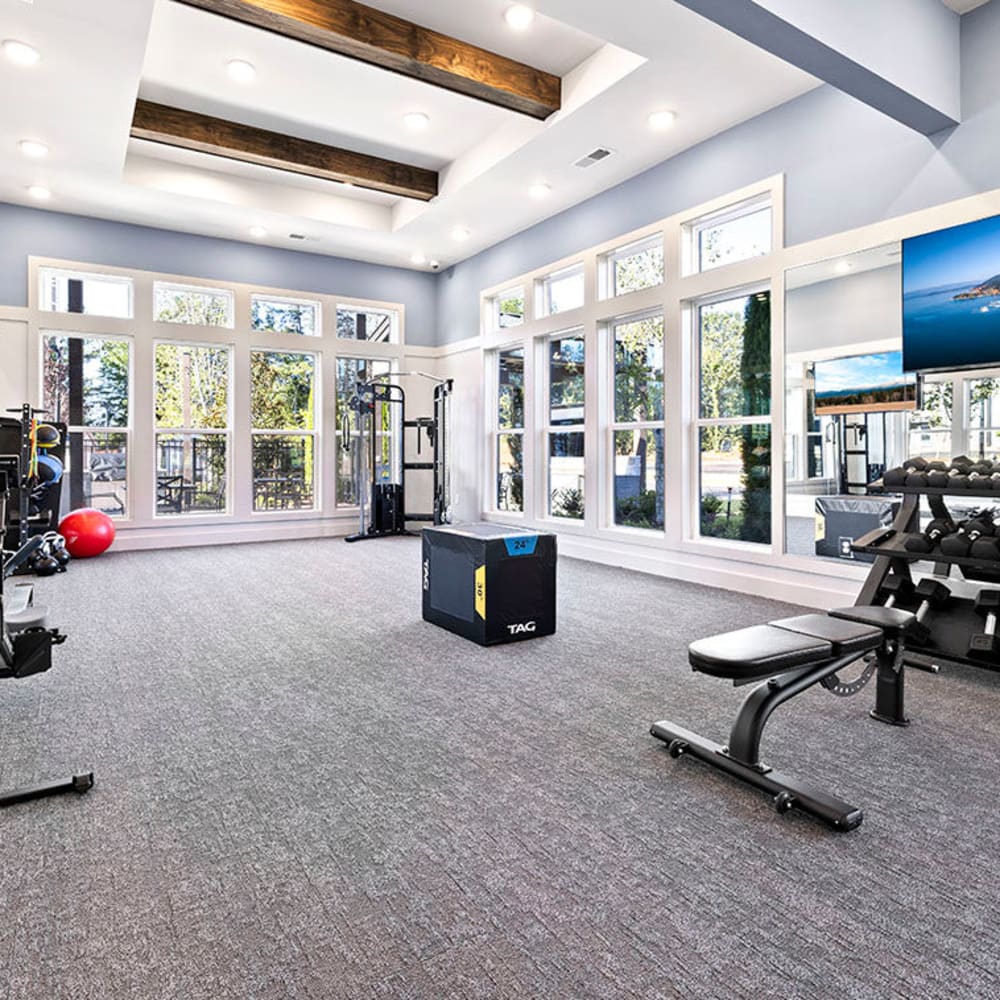 A weightlifting bench and weights in the fitness center at Novo Westlake in Jacksonville, Florida