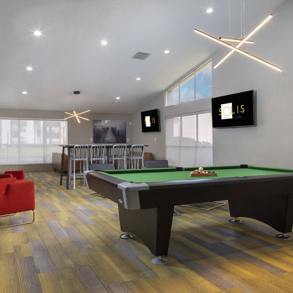 Game room in clubhouse at Solis At Winter Park in Winter Park, Florida