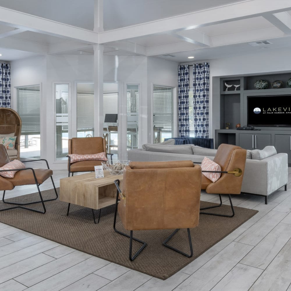 Clubhouse meeting areas with a fireplace at Lakeview at Palm Harbor in Palm Harbor, Florida