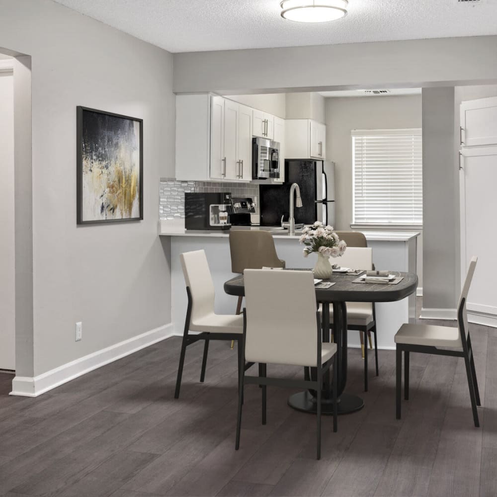 Dinning space with wood-style flooring at Lakeview at Palm Harbor in Palm Harbor, Florida