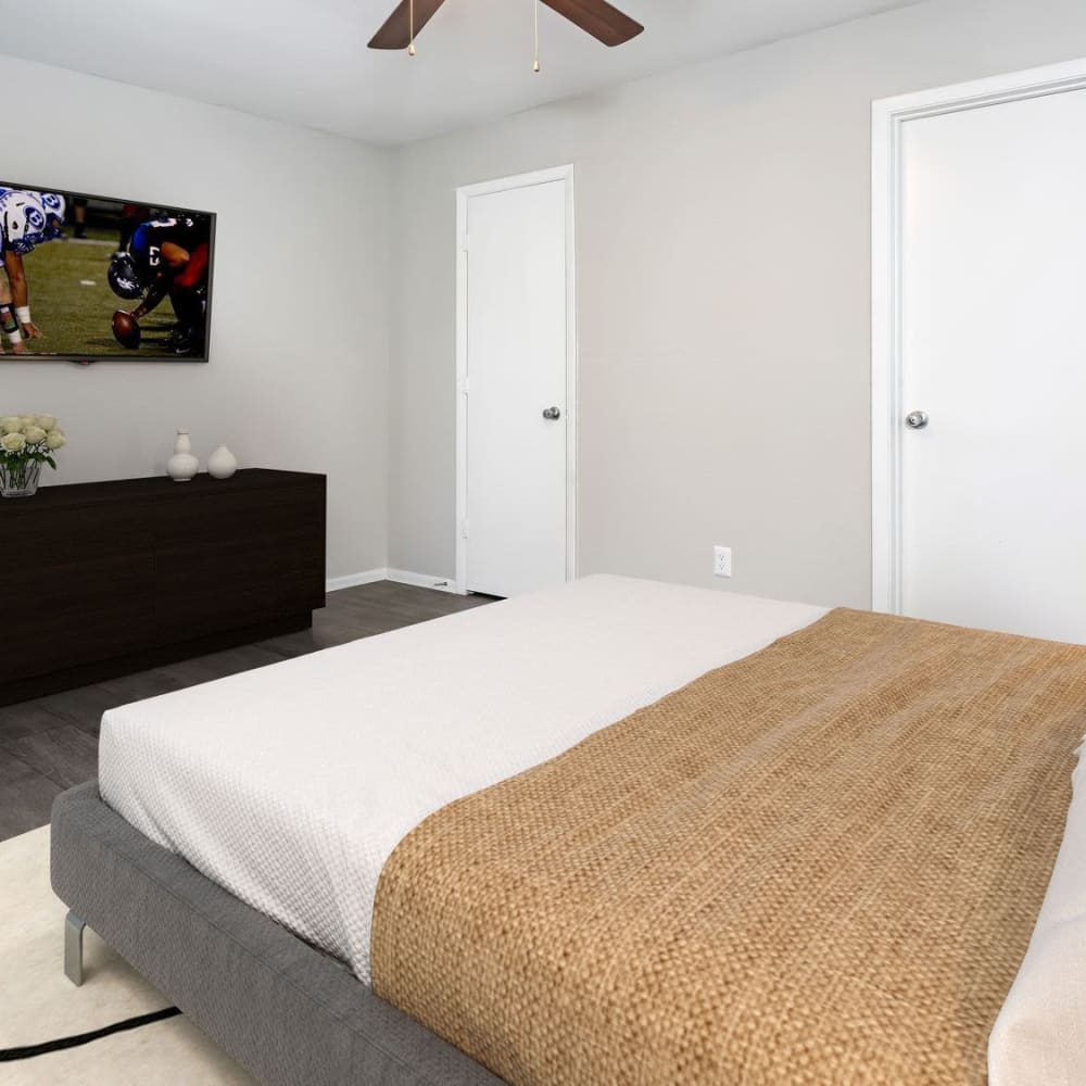 Bedroom with a ceiling fan at Bayou Point in Pinellas Park, Florida