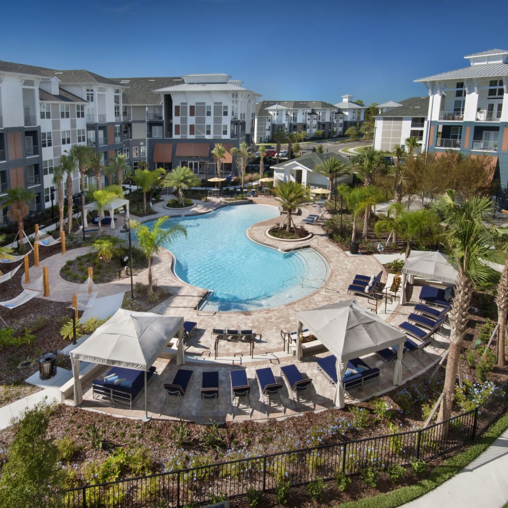 Overhead view of resort-style swimming pool at Alcove Apartments in Orlando, Florida