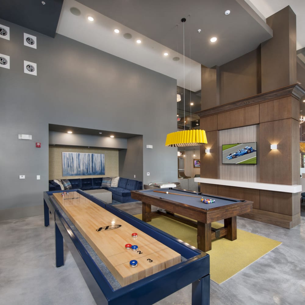 Clubhouse gaming tables at Alcove Apartments in Orlando, Florida