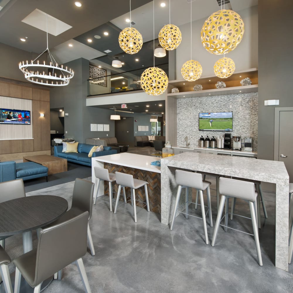 Community gathering spaces inside the clubhouse at Alcove Apartments in Orlando, Florida