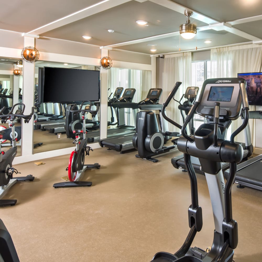 Large fitness center at Audubon Park Apartments in Orlando, Florida