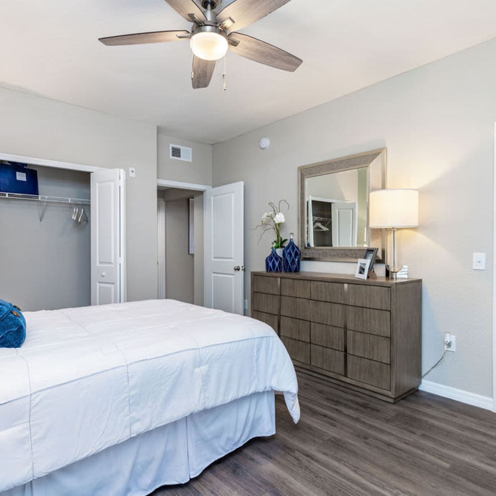 Master bedroom with a ceiling fan at Arbors at Carrollwood in Tampa, Florida