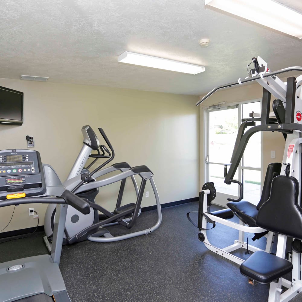 Exercise equipment in the fitness center at Elk Run Apartments in Magna, Utah
