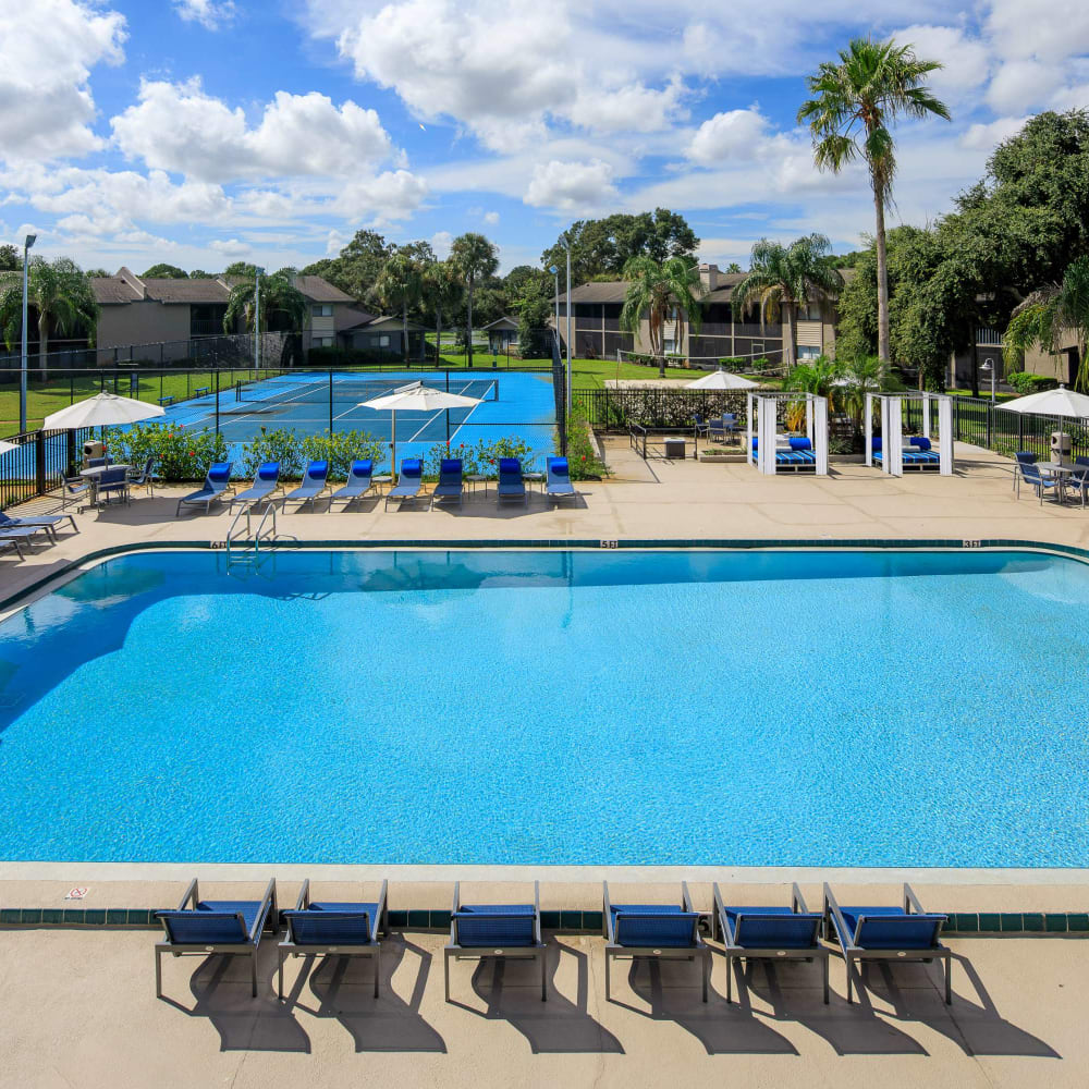 Swimming pool with pool side seating at WestEnd Apartments in Tampa, Florida