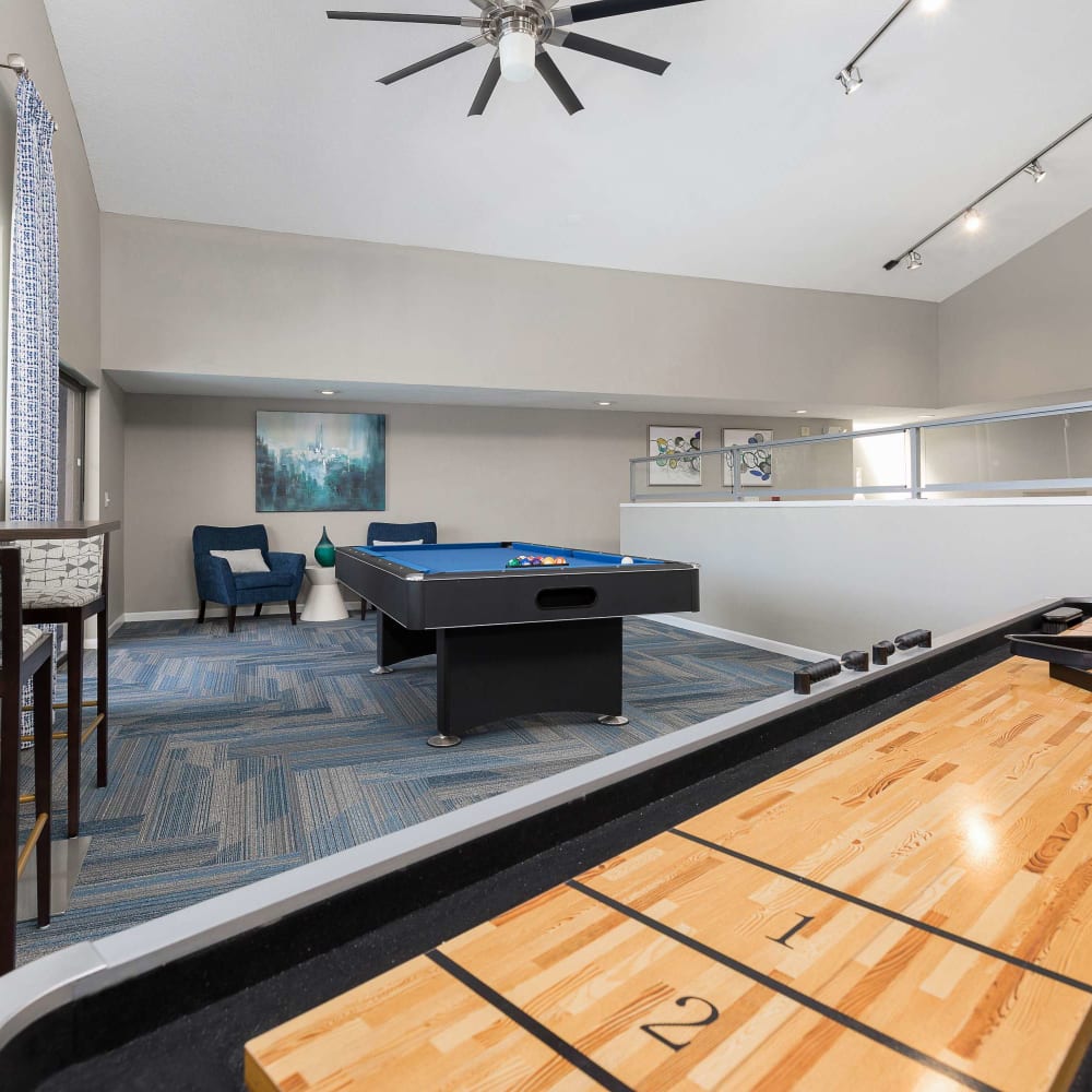 Game room with shuffle board at WestEnd Apartments in Tampa, Florida