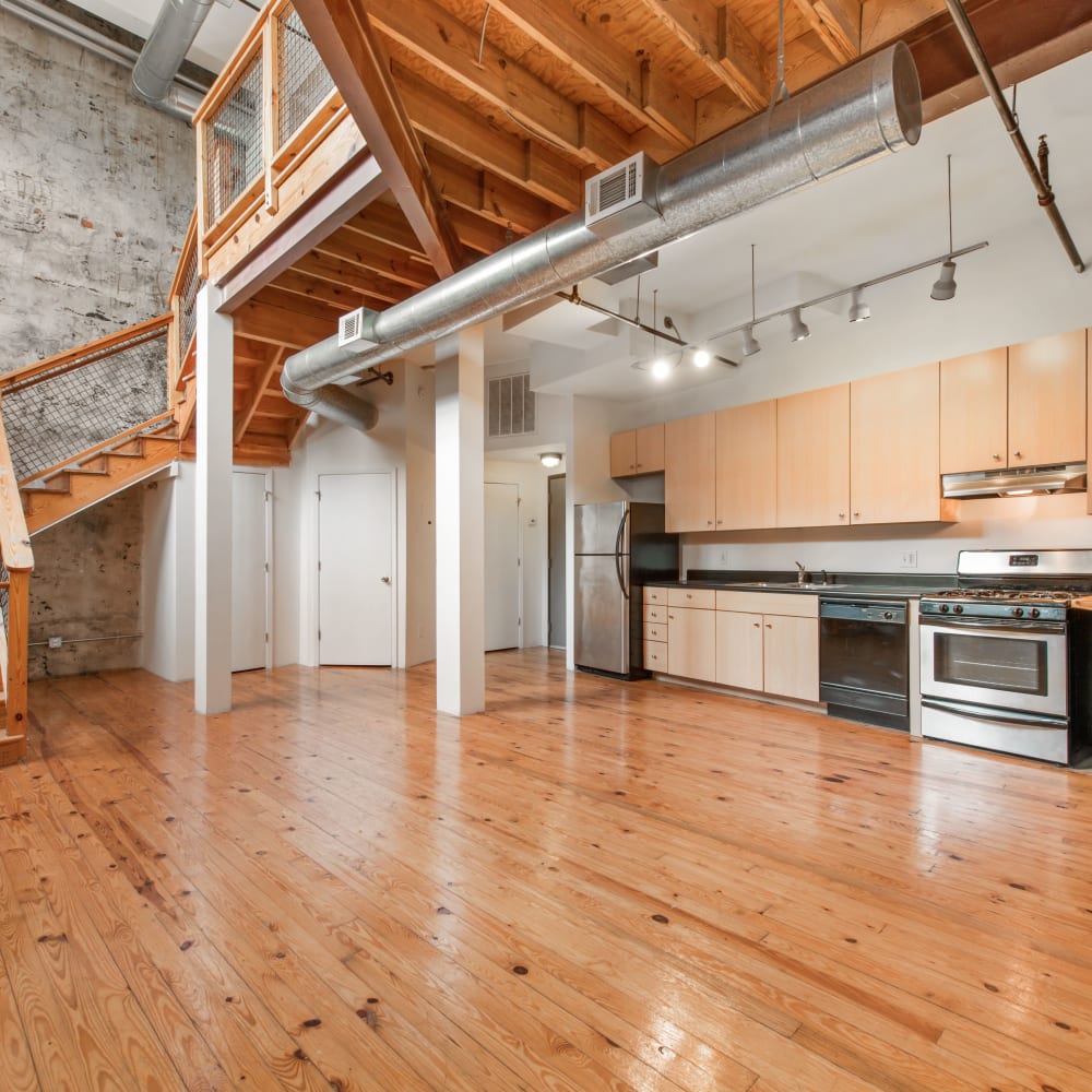 Model kitchen with wood flooring at Ice House Lofts in Decatur, Georgia