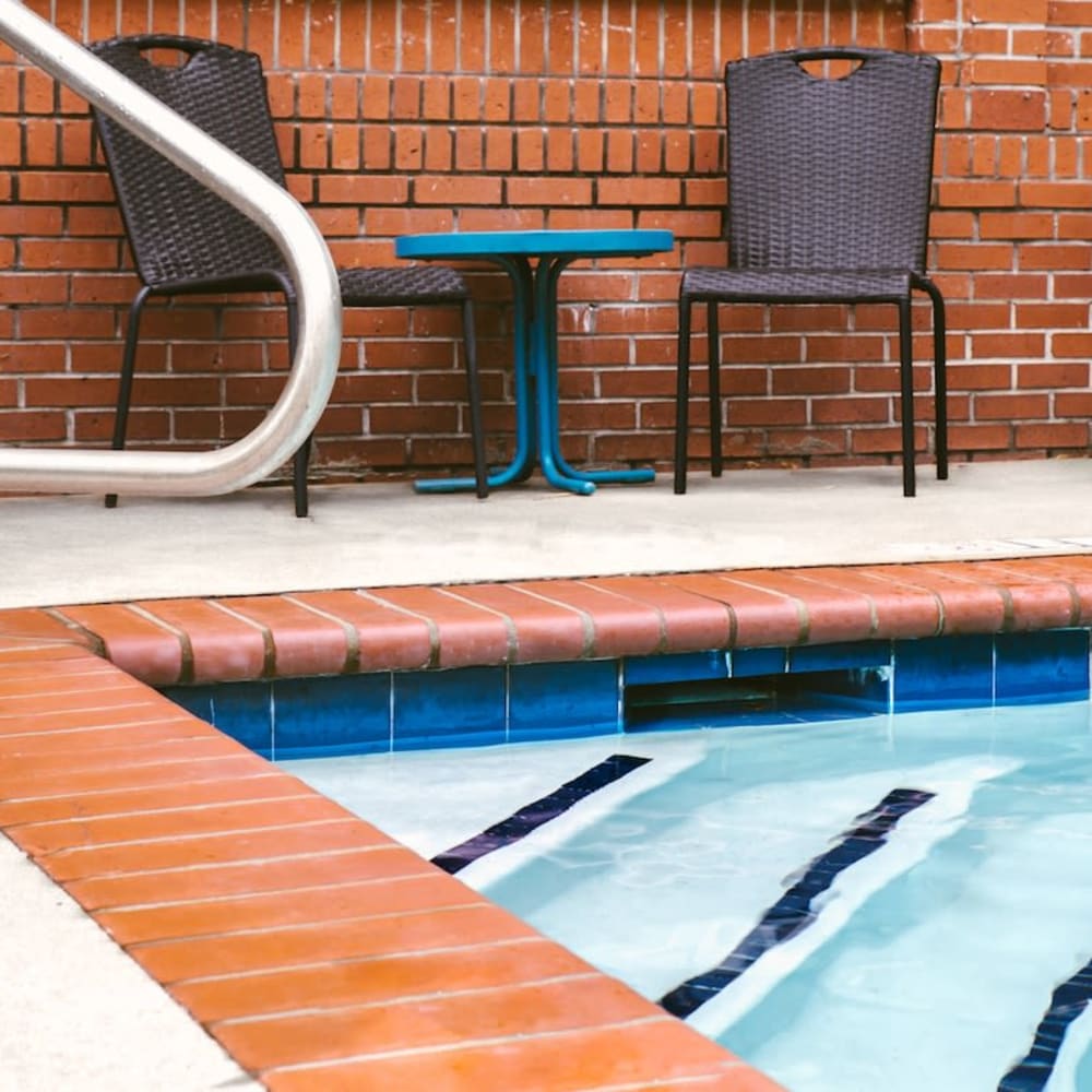 Swimming pool with brick at Ice House Lofts in Decatur, Georgia