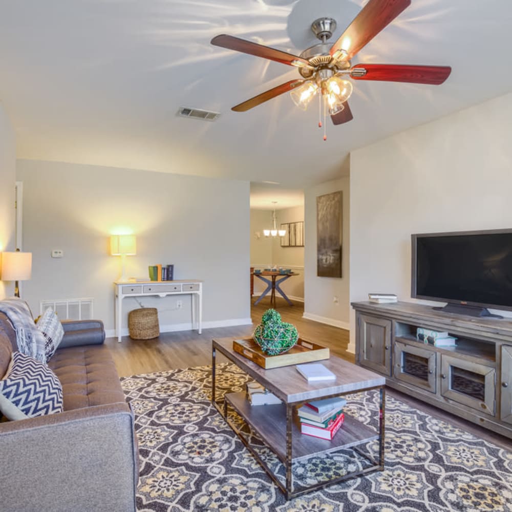 A ceiling fan in a furnished apartment living room at Spring Lake in Byram, Mississippi