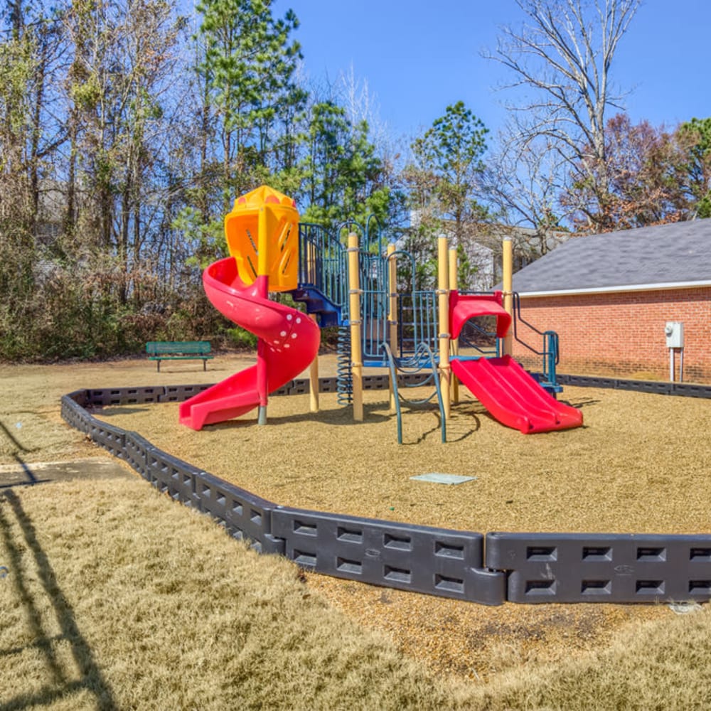 The colorful playground surrounded by grass at Spring Lake in Byram, Mississippi