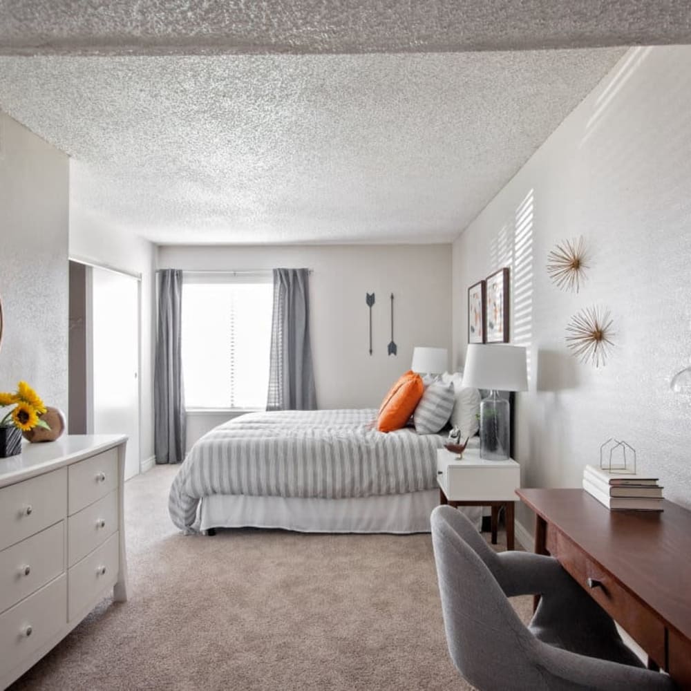 Master bedroom with plush carpeting at Enclave at Redwood in West Valley City, Utah