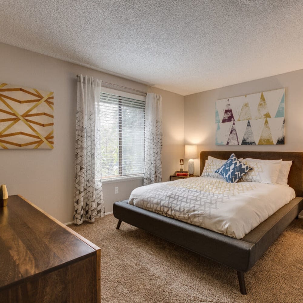 Master bedroom with plush carpeting at The Commons in Federal Way, Washington