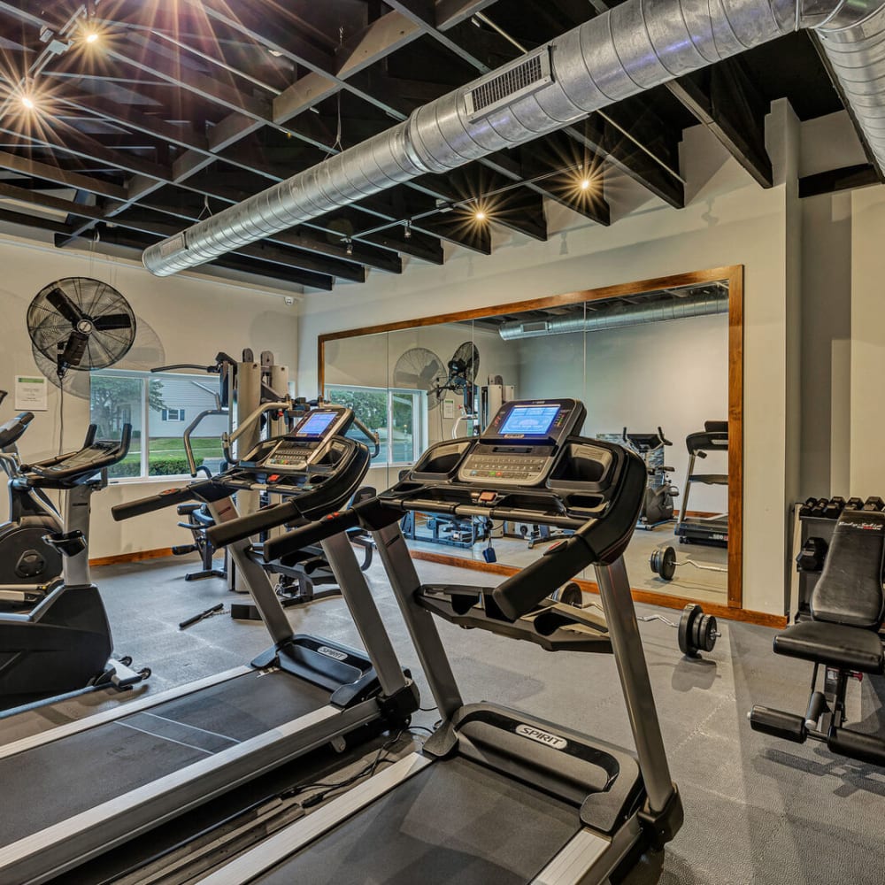 Exercise equipment in the fitness center at Huntington Apartments in Naperville, Illinois