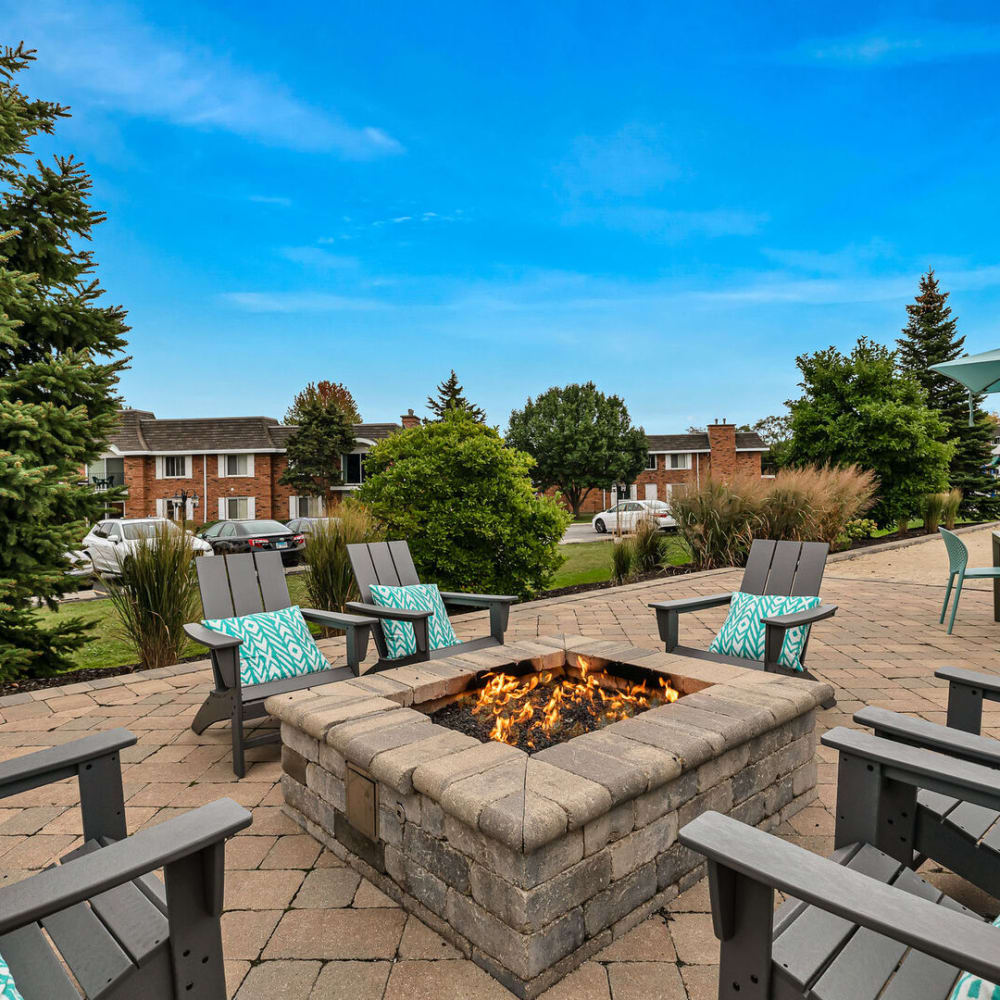 Seating around an outdoor firepit at Huntington Apartments in Naperville, Illinois