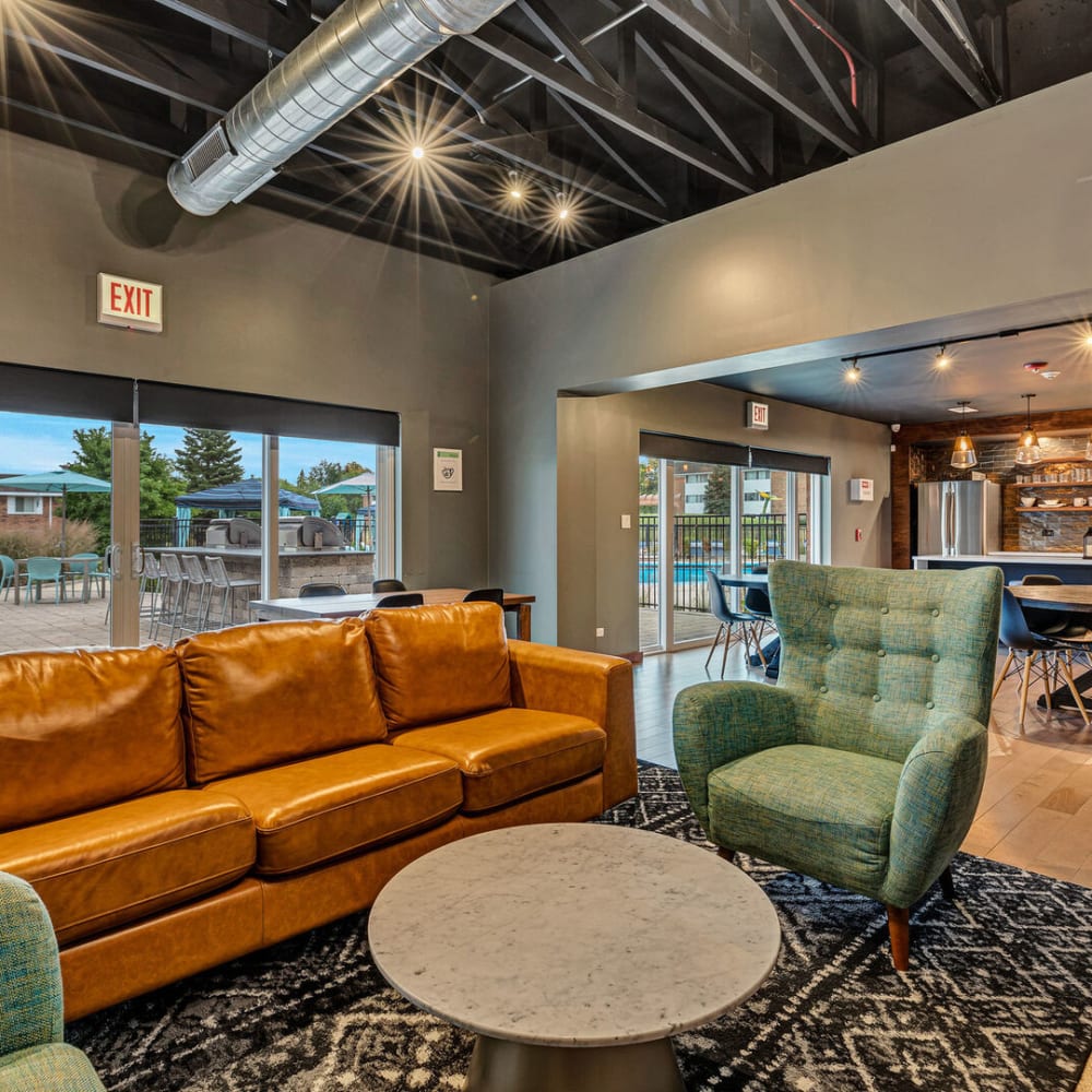 Comfortable seating in the community clubhouse at Huntington Apartments in Naperville, Illinois